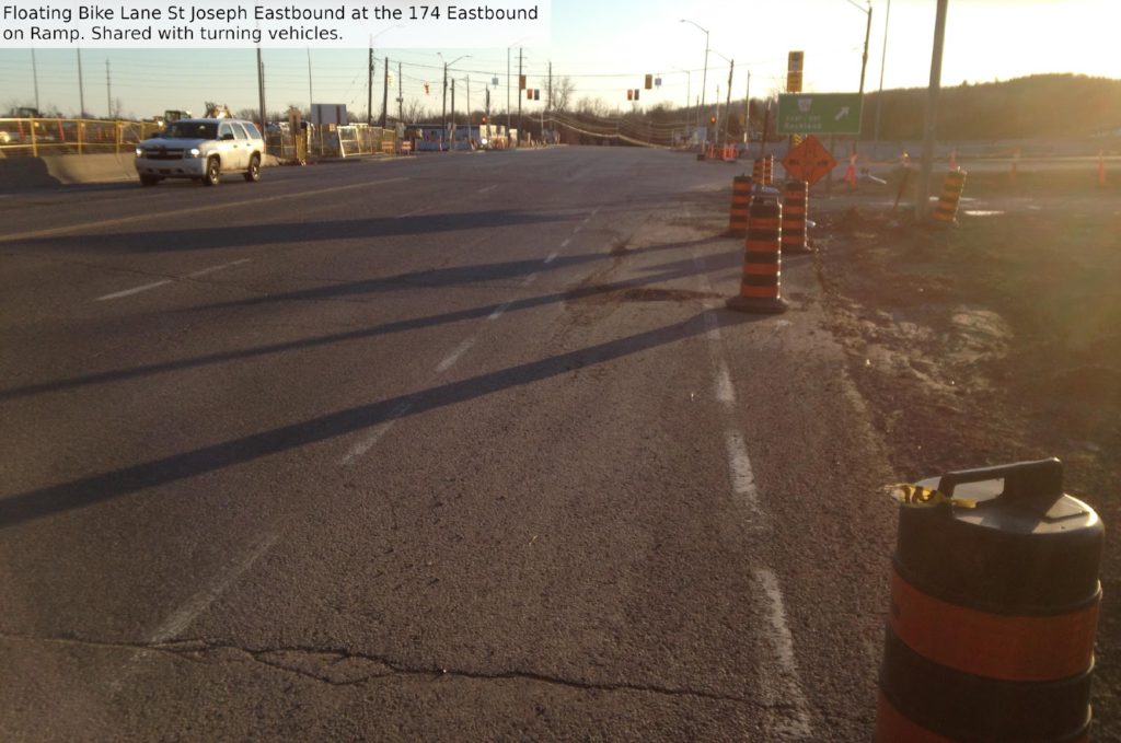 Floating bike lane St Joseph eastbound at the 174 eastbound onramp. Shared with turning vehicles.