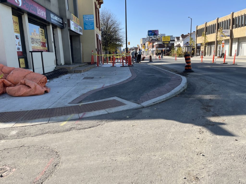 picture of TWSIs covering both the sidewalk curb cut and cycle track curb cut