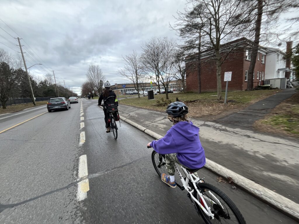 Bike bus leader and one child arriving at school.