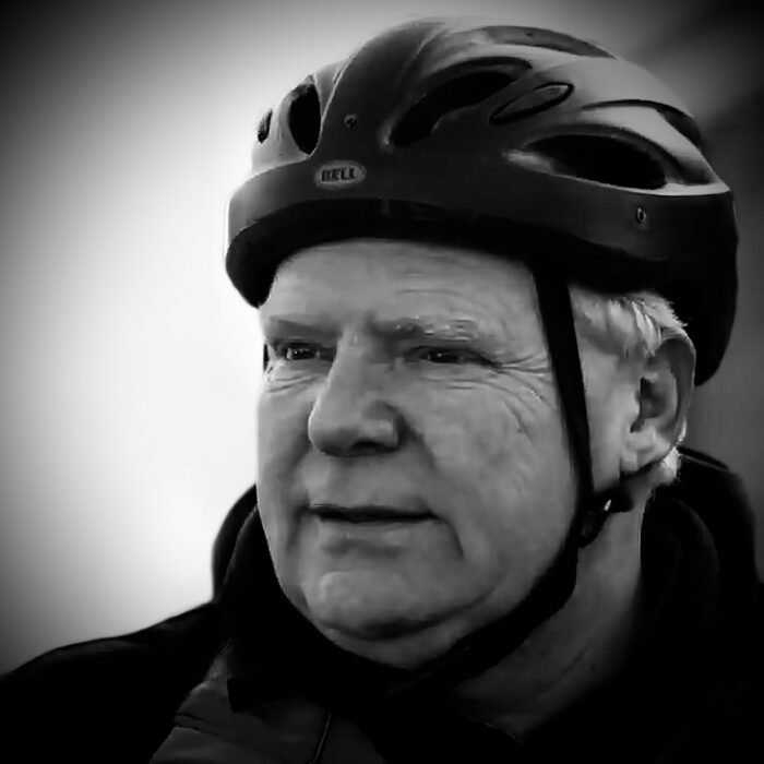 Black and white picture of Premier Doug Ford wearing a bike helmet