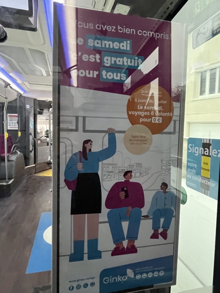 Poster on a bus saying that on Saturdays, transit is free for everyone.